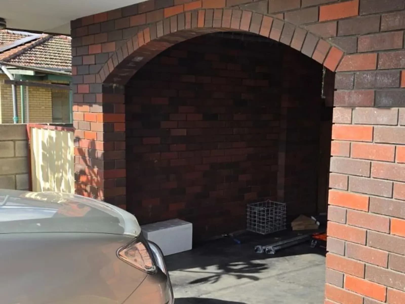 Arched brick garage opening on a Perth home standing empty, with no door fitted