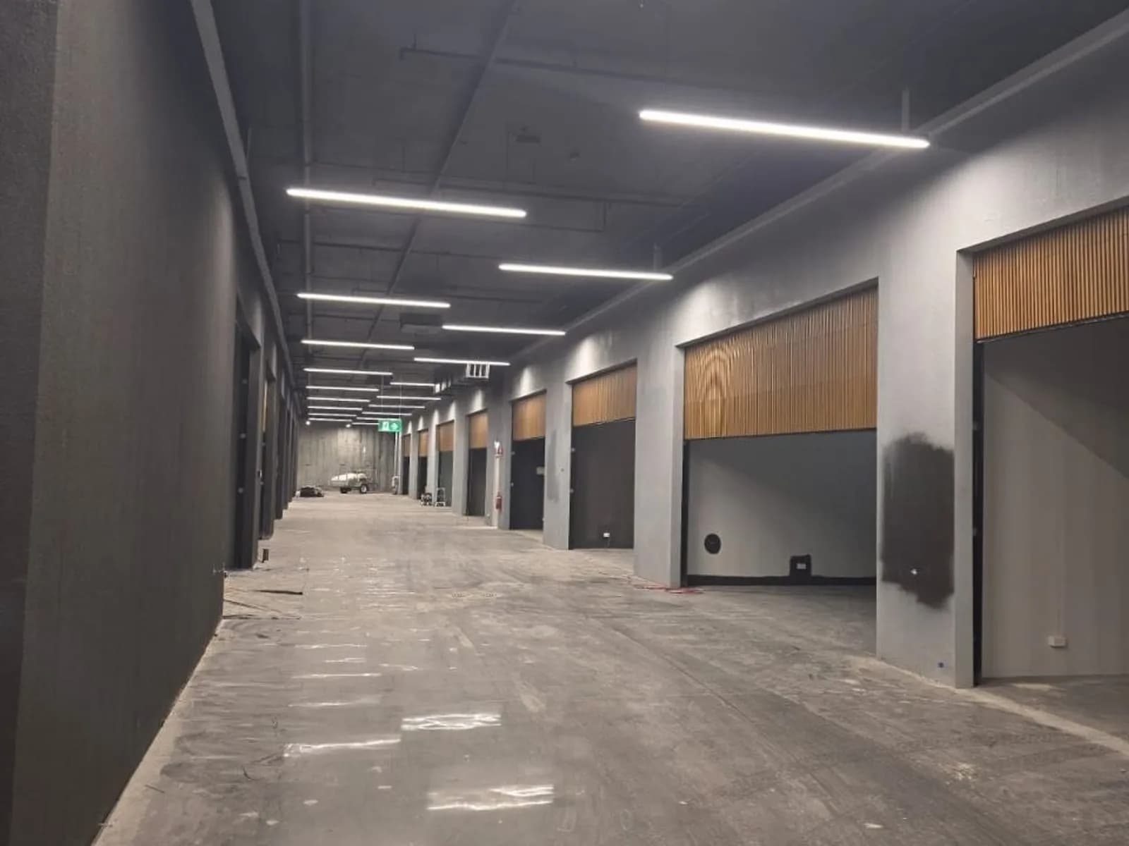 Roller shutters securing a basement carpark entry beneath a commercial building Roller shutters securing a basement carpark entry beneath a commercial building