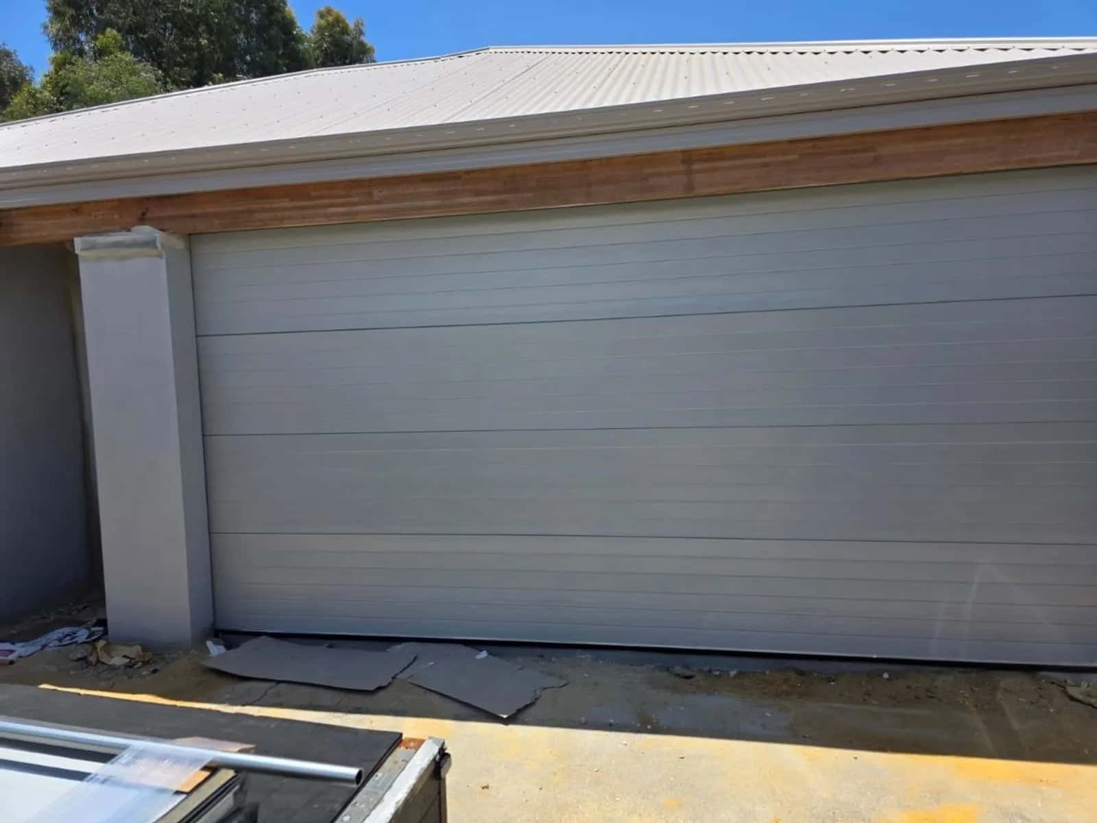 Grey sectional garage door fitted to a new build home in Ellenbrook, north-east Perth